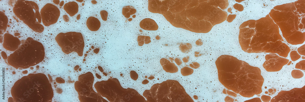 Aufkleber mottled brown and white texture with irregular patterns in a natural setting