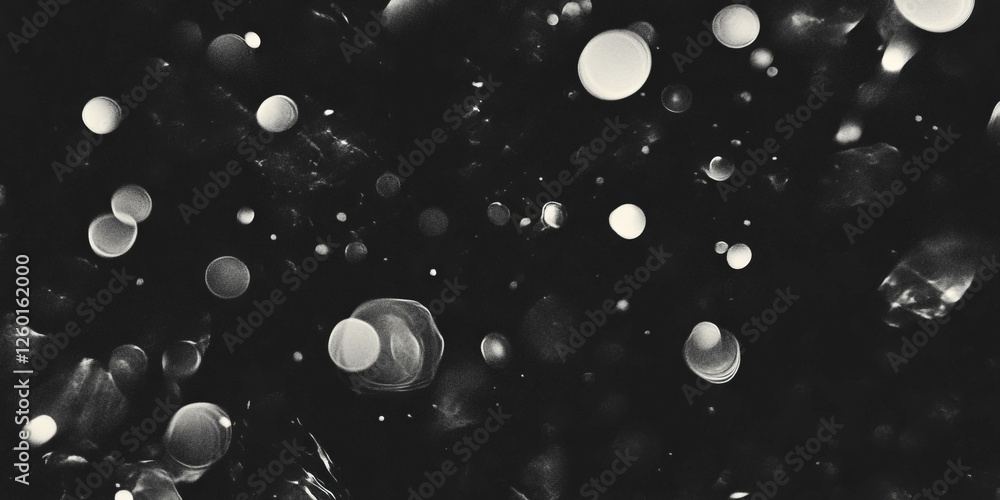 Poster mottled grayscale texture with scattered patches on a black background