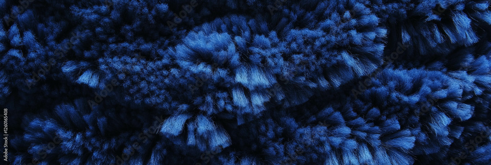 Poster navy blue dense berber carpet with looped pile and subtle texture in a vibrant setting