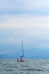 Fototapeta premium Boat in a lake in a cloudy day