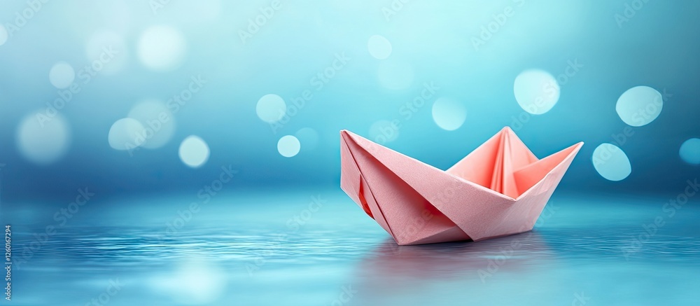 Poster pink origami paper boat positioned in the foreground against a soft blurred blue background with bok