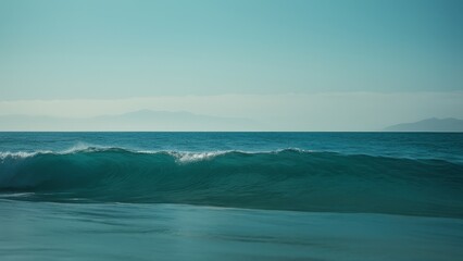 A tranquil seascape showcasing calm waters and a lush green hillside under a soft, overcast sky. Ideal for projects related to nature, serenity, or coastal beauty