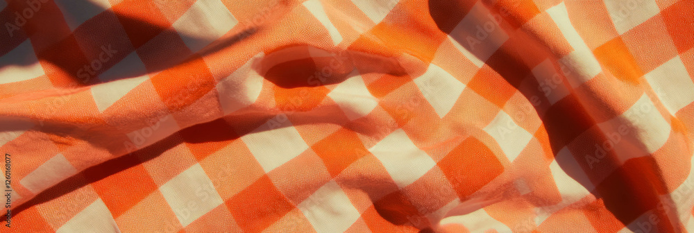 Poster bright orange checkered tablecloth with a smooth, crisp texture and large squares