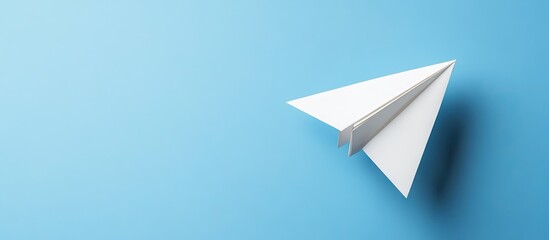 White paper plane positioned in the lower right corner against a solid light blue background symbolizing innovation and business solutions.