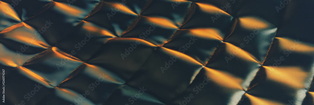 Poster exploring the texture of quilted nylon fabric combined with rough volcanic rock elements