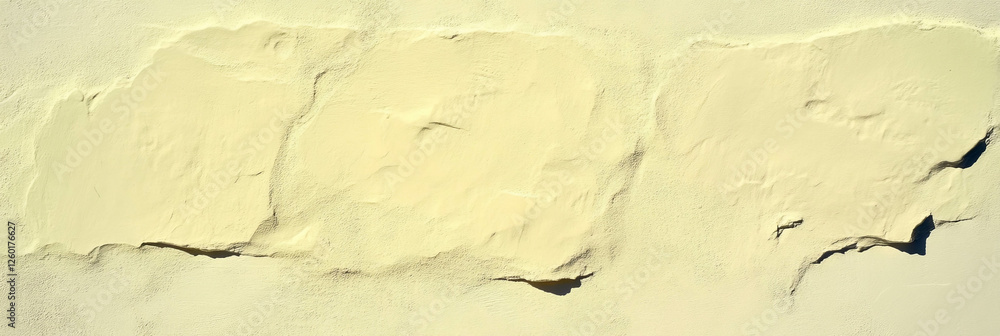 Poster sand yellow textured wall with grainy appearance and subtle grunge effect captured from above