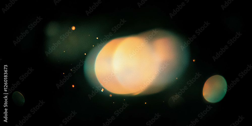 Poster Soft round bokeh texture creating a warm golden sparkle against a black background