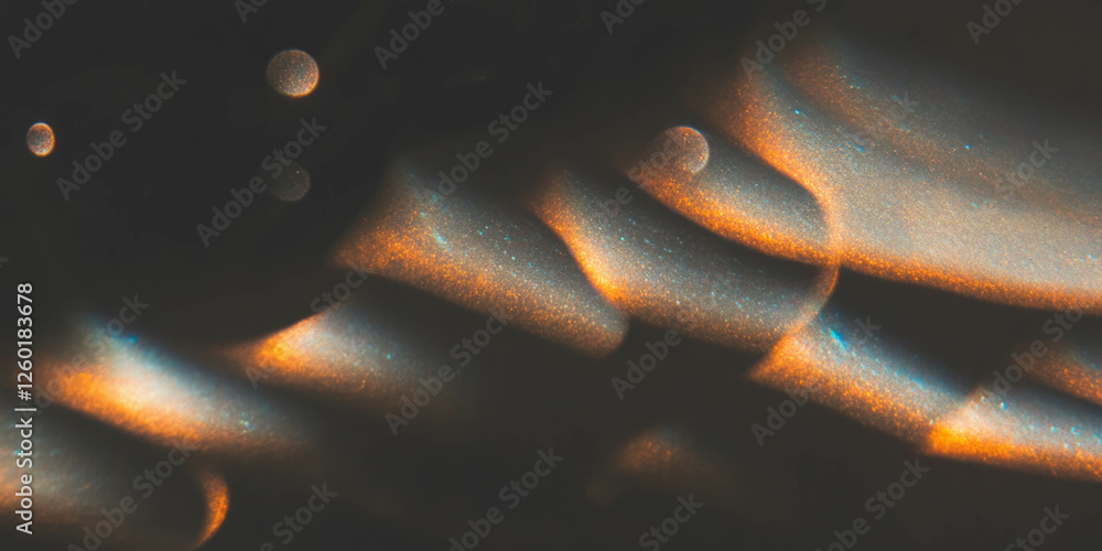 Poster Soft round bokeh texture with golden sparkle creating a warm atmosphere on black background