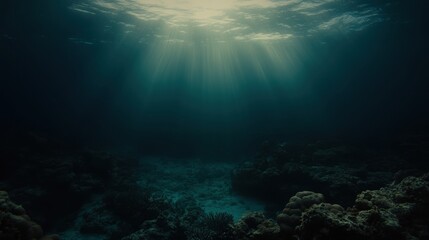 Obraz premium Sunlight Streaming Through Water Creating Ethereal Patterns Over Coral Reef in Deep Ocean