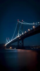 a nighttime view of a large suspension bridge.