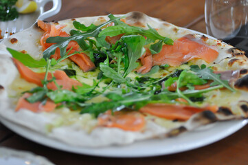 salmon pizza or salmon and vegetable pizza , smoked salmon pizza