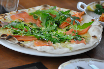 salmon pizza or salmon and vegetable pizza , smoked salmon pizza