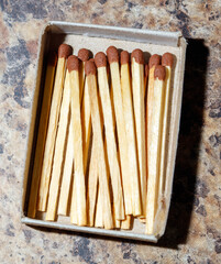 A box of matches sits on a table