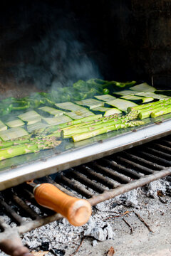 Barbecue of green peppers, zucchini and green asparagus. Outdoor smoked grill. BBQ. Vertical image.