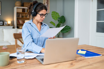 Finance and economy. Young woman, small business owner, working online at home office, preparing for video call for presentation and online coaching. E-commerce professional occupation freelance work