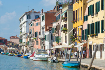 Sunny September day on the city embankment. Venice, Italy