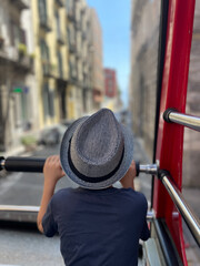 A young boy is enjoying a beautiful and scenic view while on an exciting bus tour