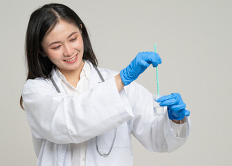 Asian gynecologist with cervical cancer specimen collection kit