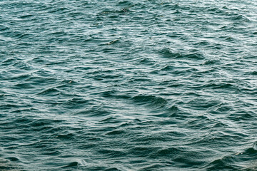 Ripple water surface, green color natural background, ocean 