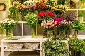 Flower shop displaying colorful bouquets and greenery for sale