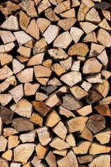 Firewood logs stacked creating a log texture wallpaper background