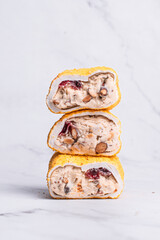 Vegan Turkish delight on a light background, Turkish delight with nuts, almonds, pistachios, dried fruits, Turkish sweets, nut nougat