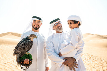 Three generation family making a safari in the desert of Dubai. Grandfather, son and grandson...