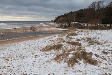 Cloudy December day on the shore of the Gulf of Finland. Komarovo Coast, Leningrad Region. Russia