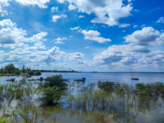 The fish trap on the water with beautiful clouds sky.
