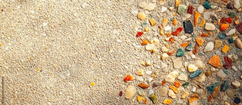 Poster terrazzo floor texture featuring small colorful stones on a sandy background with ample space for te