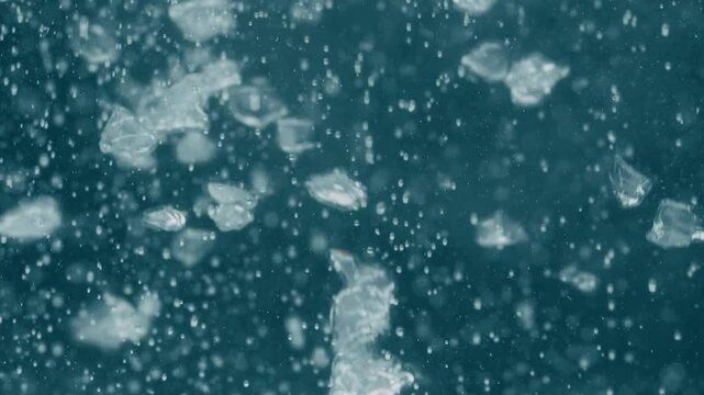 Microplastics or Plastic Fragments Sinking Underwater. A Visual Representation of Ocean Pollution and Its Impact