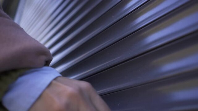 Female Business Owner of Local Store opening garage storefront