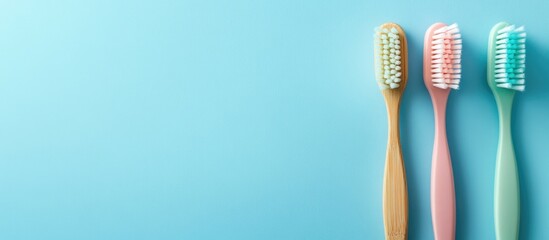 Colorful Toothbrushes on a Soft Blue Background Creating Ideal Space for Promotional Text or Health Advice