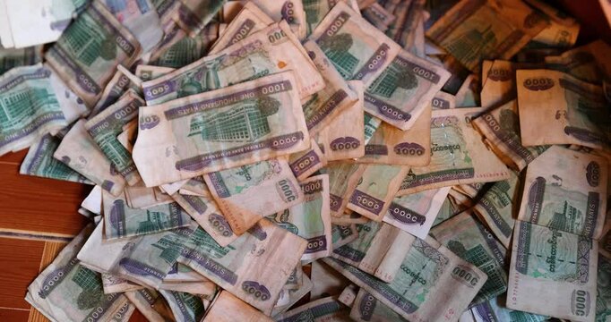  A large amount of Myanmar (or Burmese) Kyat banknotes are scattered on the floor, Myanmar Money 1000 Kyats.