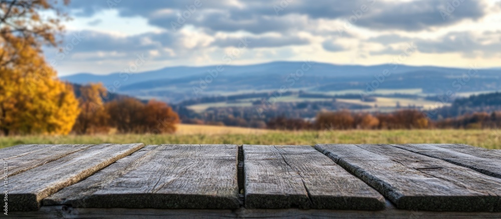 Aufkleber wooden table in foreground with scenic countryside view and cloudy sky ideal for adding text or grap