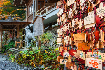 Kifune Shrine in Kyoto, Japan with beautiful autumn scenery. The shrine is dedicated to the god of...