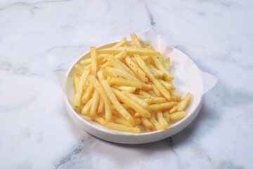 French fries with ketchup on white plate