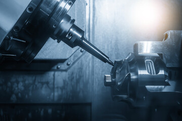 The 5-axis CNC milling machine  cutting the automotive part with solid ball nose end mill tool.