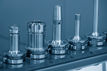 Close up scene the various type of CNC tool holder in the light blue scene.
