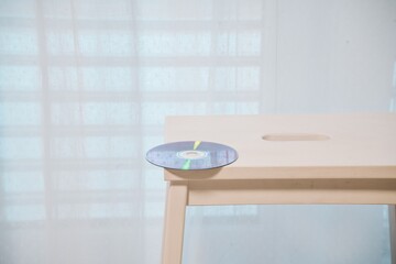 Compact Disc on Wooden Table Edge – Digital Nostalgia