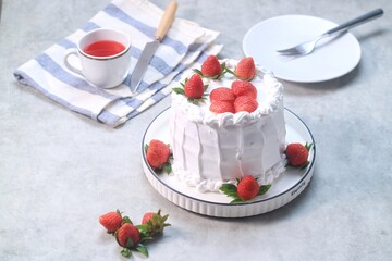 Strawberry cake, vanilla sponge cake with cream and fresh strawberries. Summer cake.
