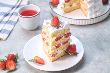 Strawberry cake, vanilla sponge cake with cream and fresh strawberries. Summer cake.
