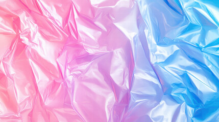 Obraz premium Crumpled plastic wrap with gradient of pink and blue colors, creating vibrant and textured background. smooth surface reflects light, enhancing visual appeal