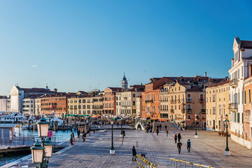 The Riva Degli Schiavoni was built in the 19th century and it is a promenade that sits on the waterfront at St. Mark's Basin and main pedestrian street, overcrowded of tourists in Venice. Italy, 2019