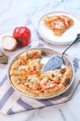 pizza with sauce, sausage and paprika 
