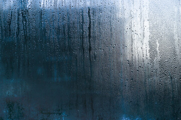 Wet glass background. window with water droplets 