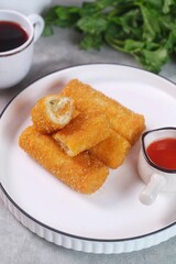 vegetables risoles or risol sayur or risoles sayur stuffed with veggies and enclosed in crepe-like wrappers and rolled into bread crumbs and fried. served on white plate and chili. selected focus	appe