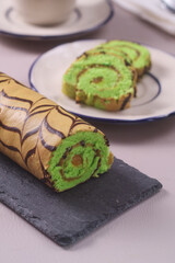 bolu gulung pandan  or pandan Sponge rolls filled with kaya jam tastes sweet, soft and delicious. 
