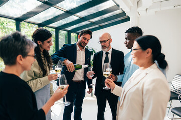 Businessmen and businesswomen making a corporate party after the business conference to celebrate...