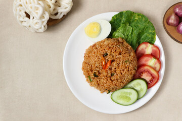 Delicious Nasi Goreng: Indonesian Fried Rice with Egg, Vegetables, and Kerupuk